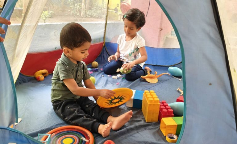 Soft toys and cribs in the Palnaghar room of Utkarsha Day Care Pune